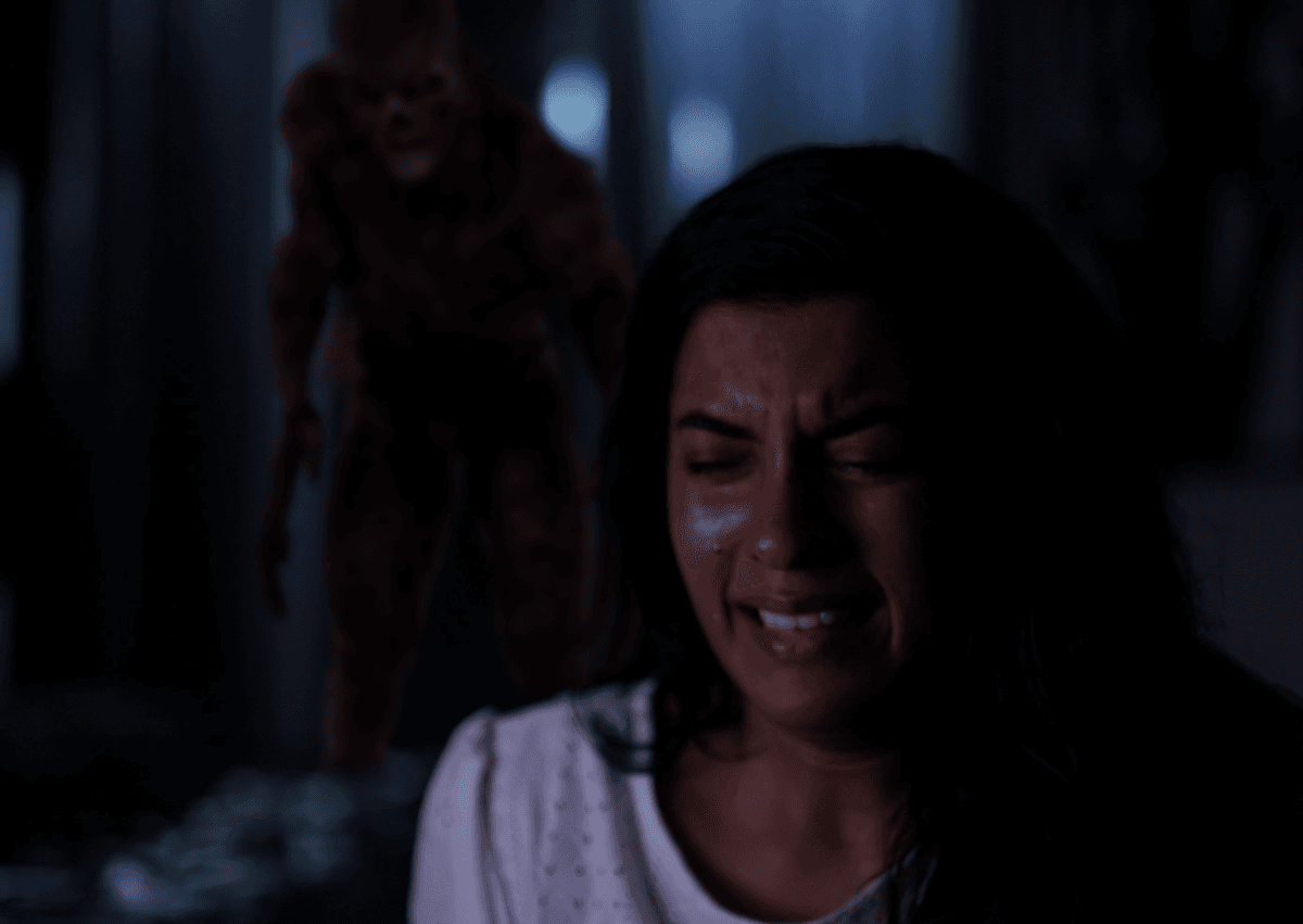 Zombie behind crying young lady